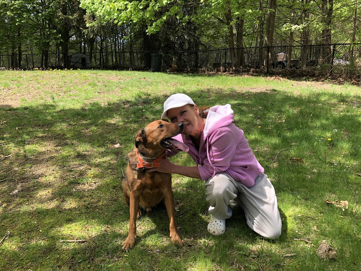 Katie Shannon with her dog Hoover outdoors in Ipswich