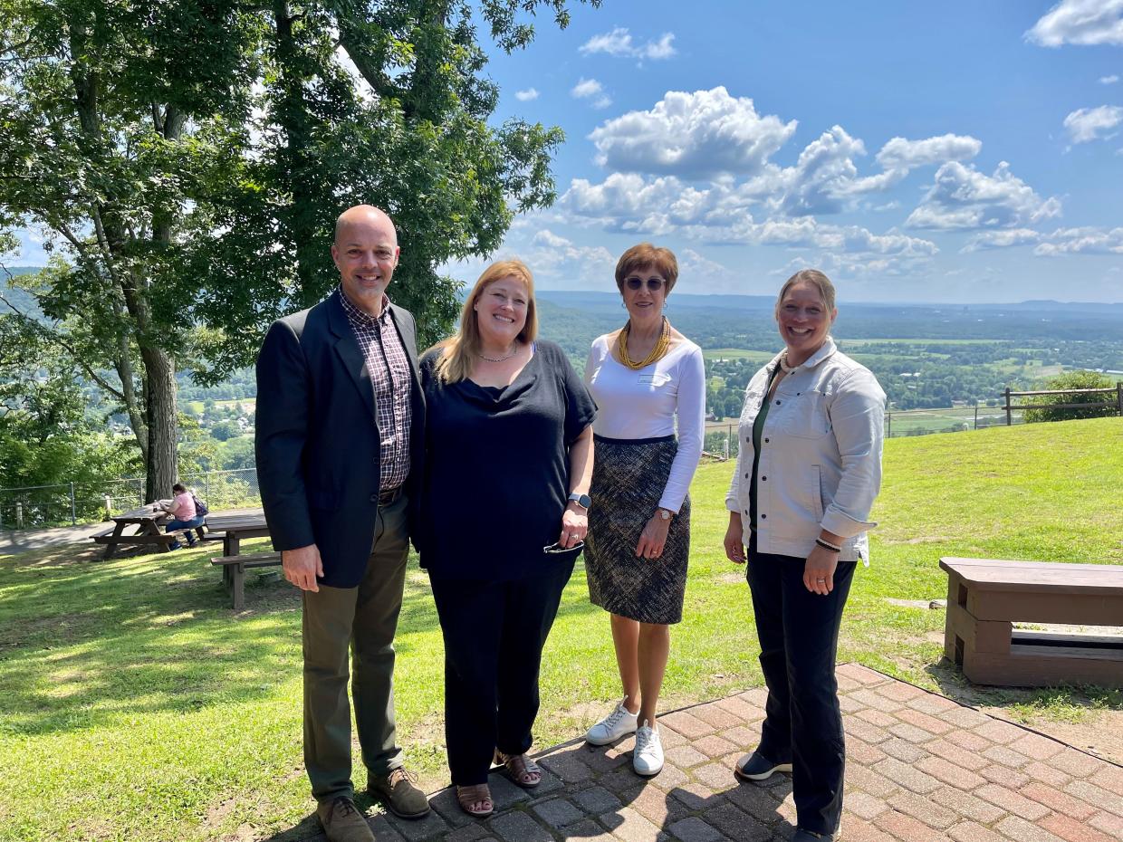 From left to right: Senator Adam Hinds, Representative Susannah Whipps, State Auditor Suzanne Bump, Representative Natalie Blais at Mt. Sugarloaf in Deerfield.