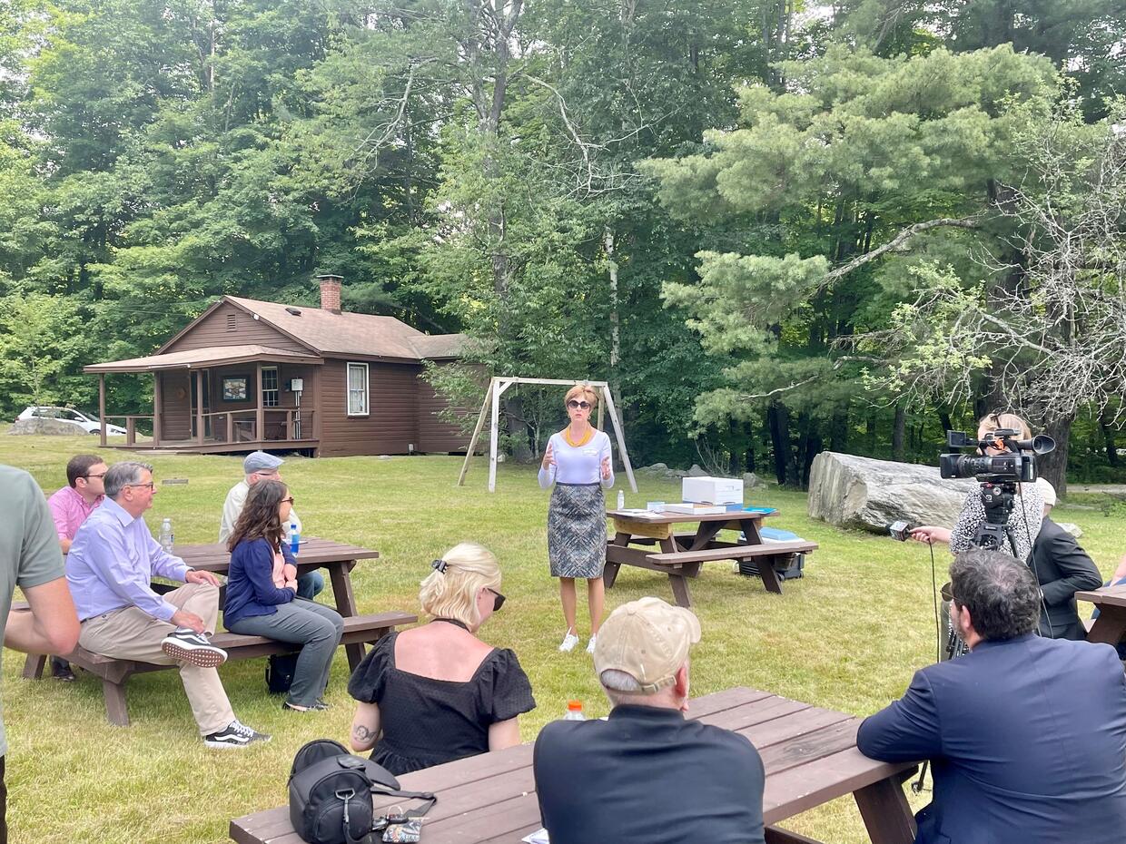 Auditor Bump speaking with attendees during the stop at the Dubuque State Forest in Hawley.