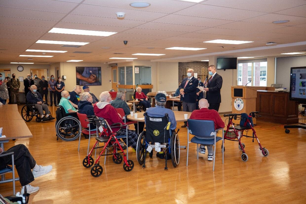 Medal of Honor Recipient Michael J. Fitzmaurice greets Soldiers’ Home in Holyoke Residents in the Canteen (Dave Wilkinson, Massachusetts National Guard)