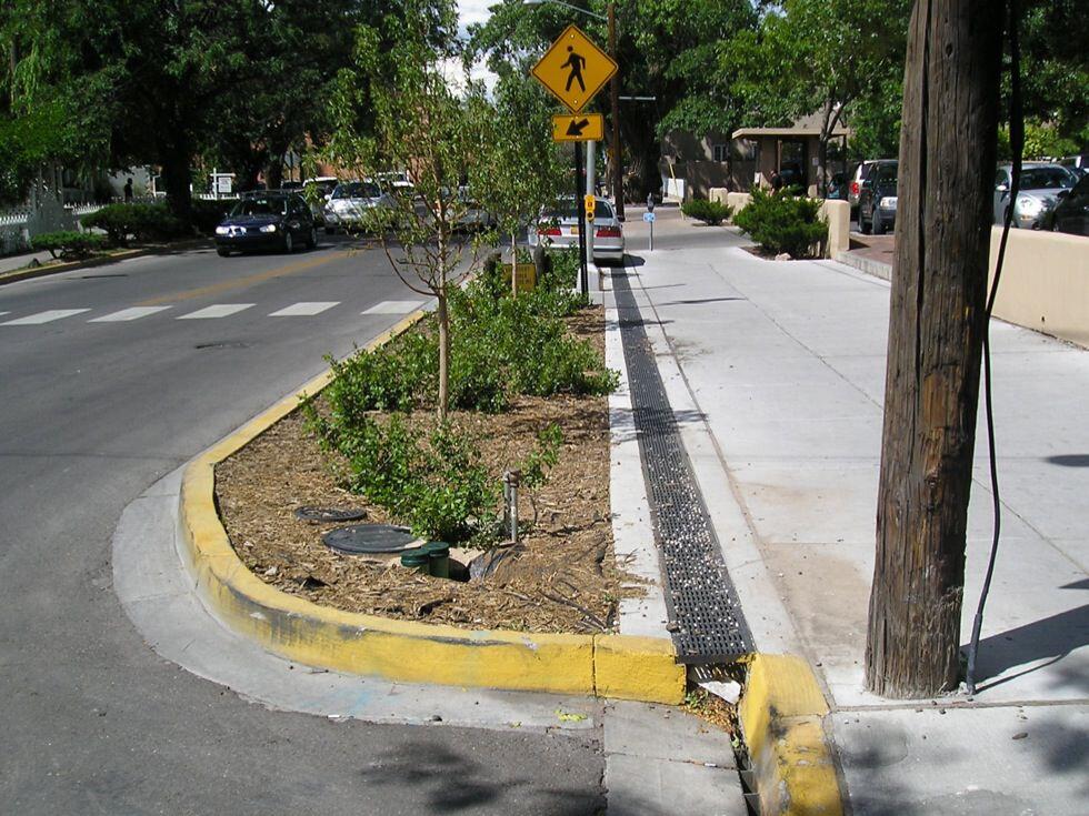 Curb bumpout at pedestrian crossing on two lane road