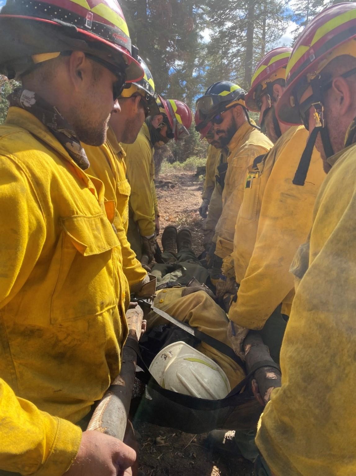   NorEast #1 practice a medical extraction during their break on the Dixie Fire, California. Photo: B. Mazzei, MassWildlife