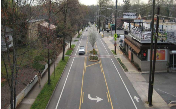 Road diet showing two lane road with two way center left turn lane