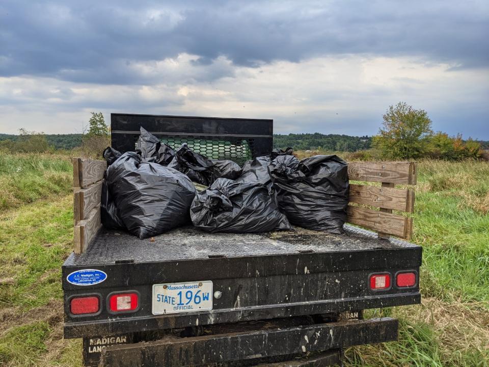 MassWildlife truck brings away bagged trash for disposal