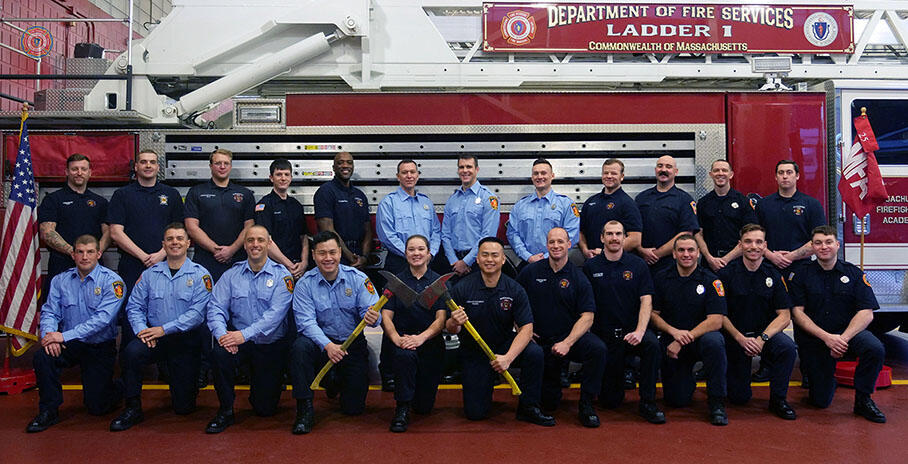 23 firefighters on and around a ladder truck