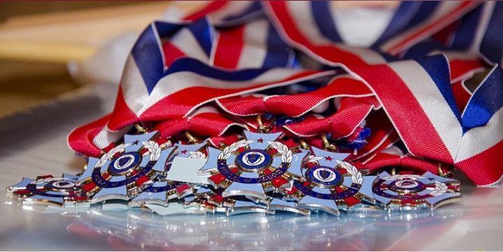 A group of medals laid on a table