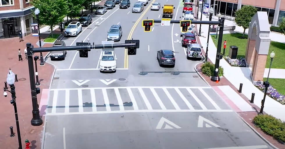 Overhead view of enhanced crosswalk with high visibility markings and signals.