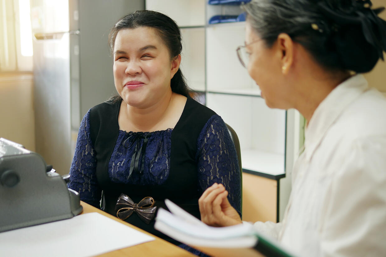 Young visually impaired woman at internship