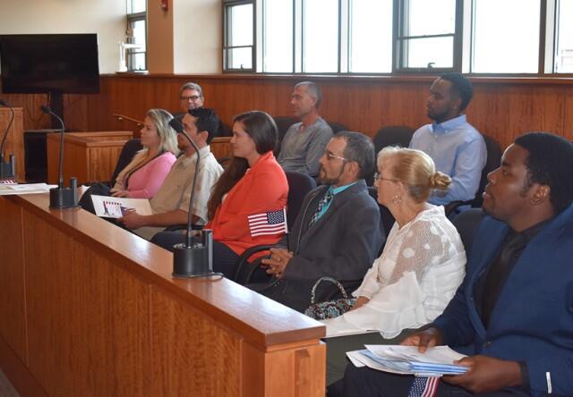 citizens participating in a naturalization ceremony
