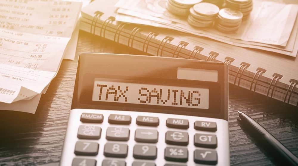 A photo of a calculator reading: Tax Saving