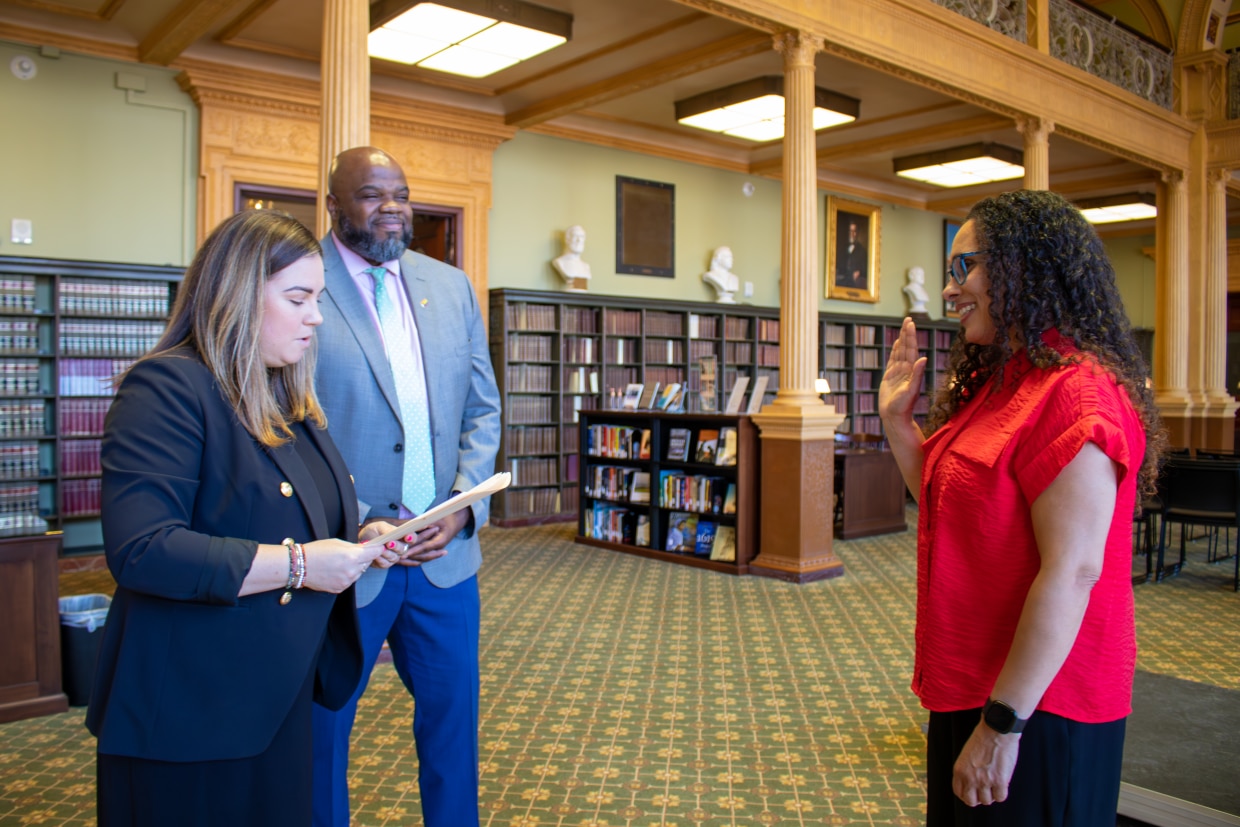 Dr. Ericka Fisher was sworn in as a member of BESE in the State Library of Massachusetts. 