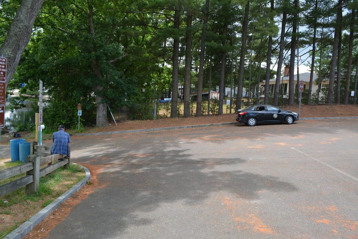 parking in paved lot which terminates at ramp and water