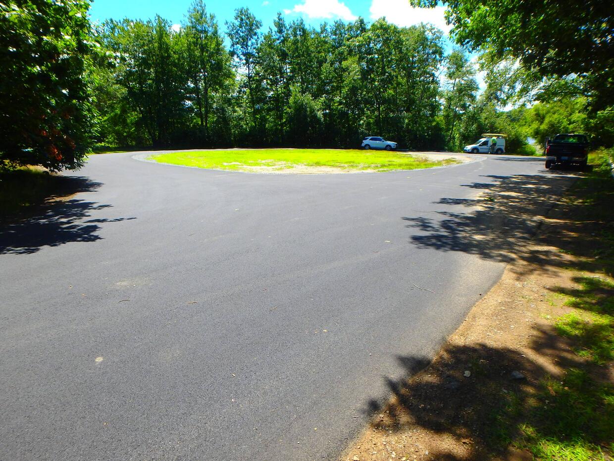 large circular paved parking area near ramp