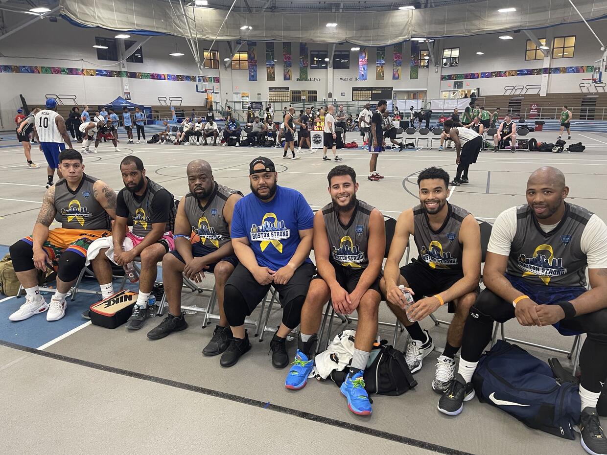 A group of men in basketball uniforms