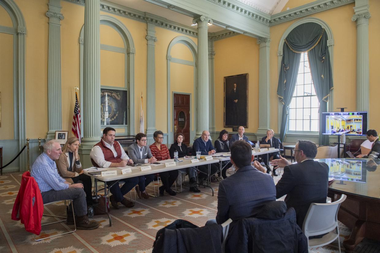 Members of the Stewardship Council seated during their December 14, 2023 meeting at the Massachusetts State House.