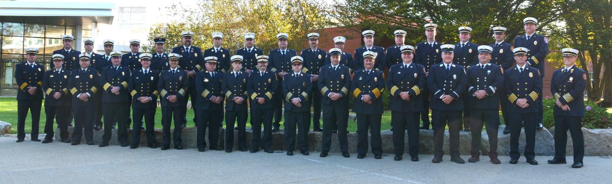 Photo of 34 fire chiefs in uniform