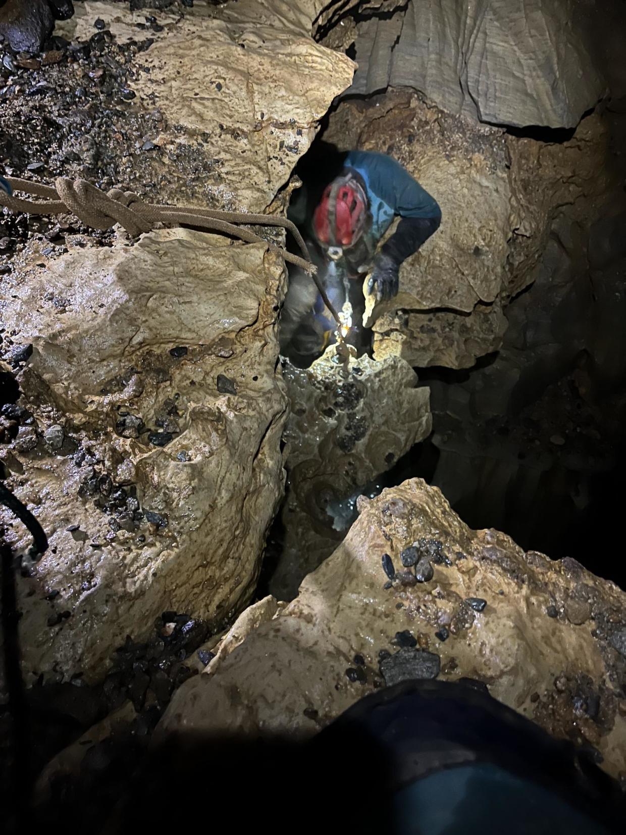 MassWildlife staff member repelling into cave