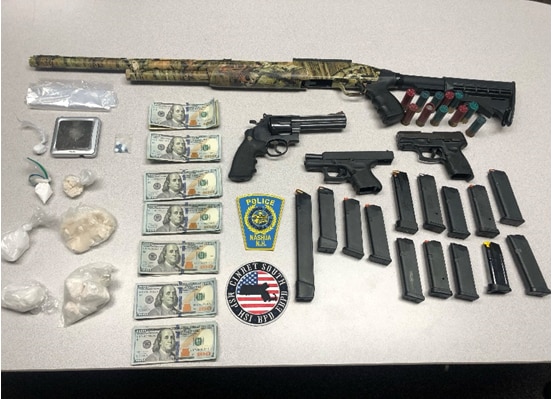  Picture of guns, cash, and drugs recovered from arrest