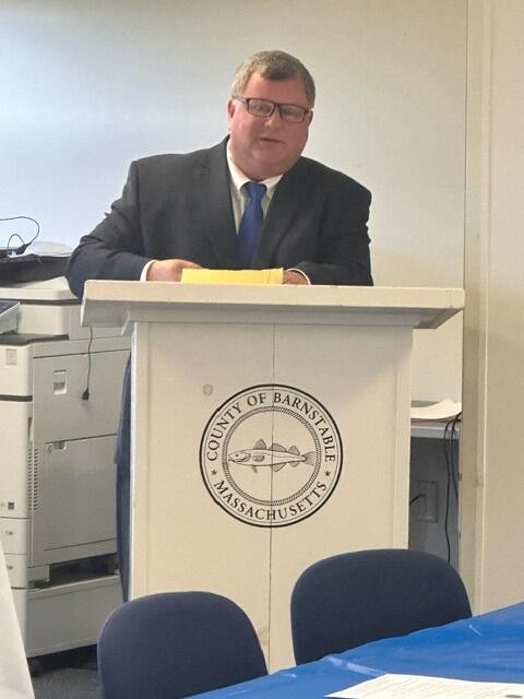Orleans District First Justice Robert Welsh III speaking at podium