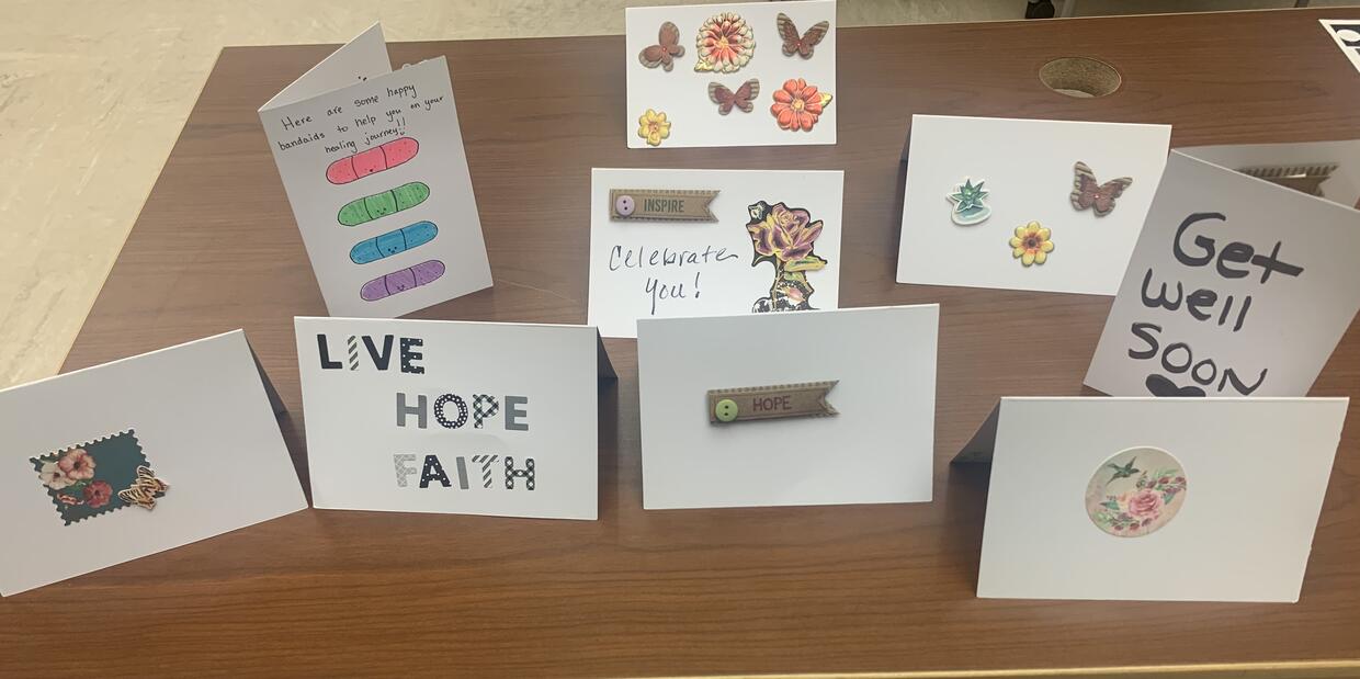 Cards decorated with uplifting messages displayed on a table