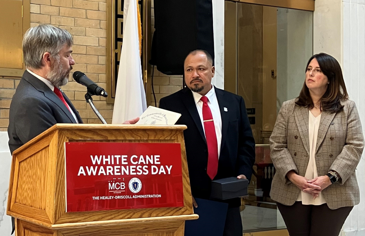 Representative Steve Owens, Boston Police Officer Robert Figueroa, Senator Robyn Kennedy