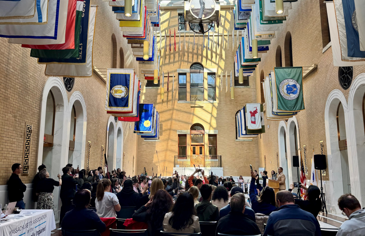 Attendees gathered inside the Great Hall of Flags