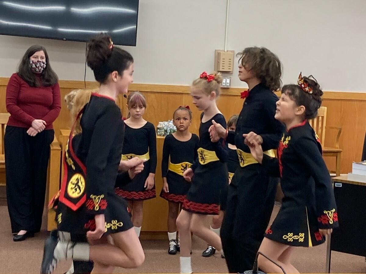 A group of children perform Irish step dance