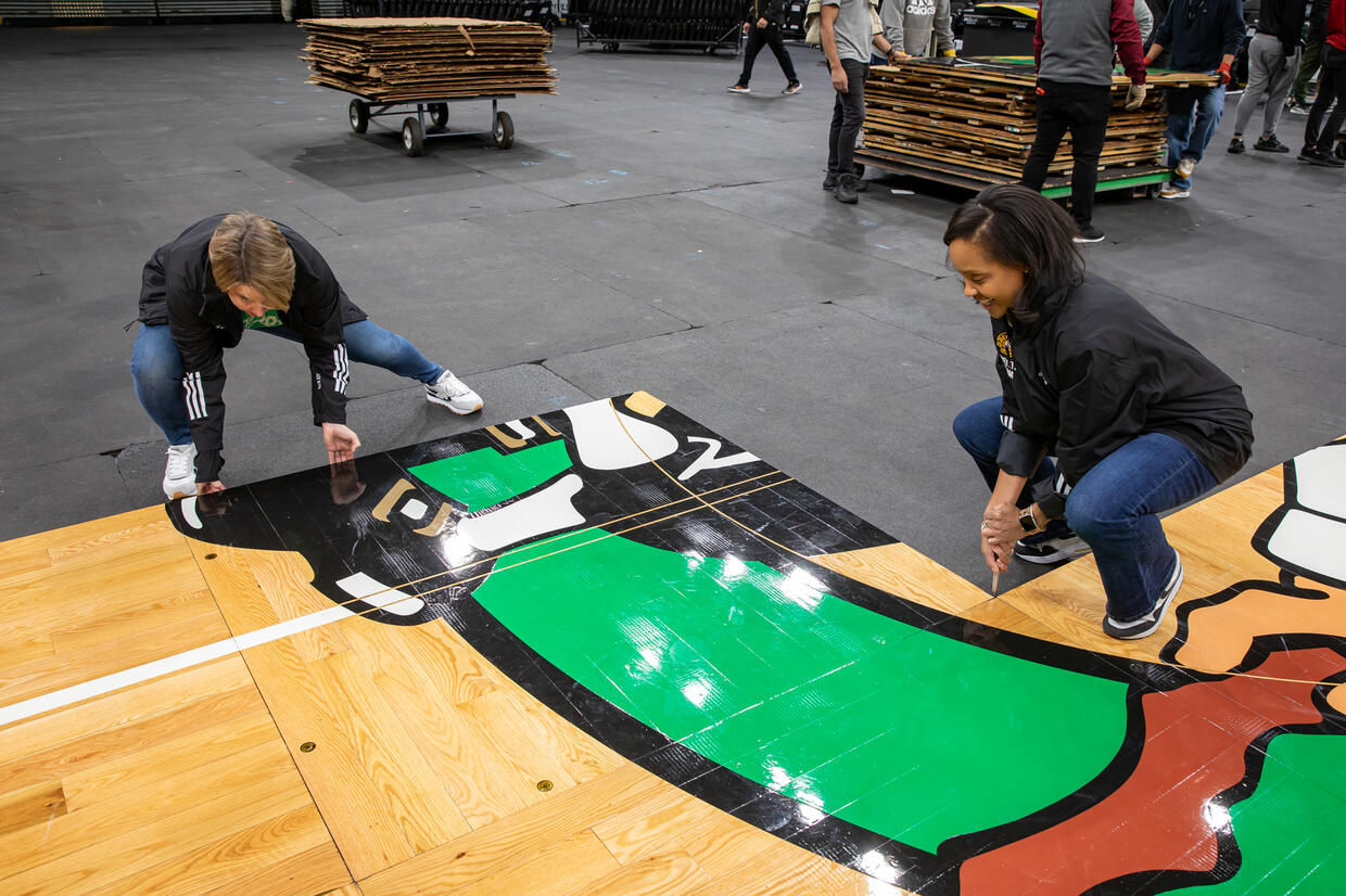 Governor Healey and Secretary Jones put down the parquet at TD Garden.