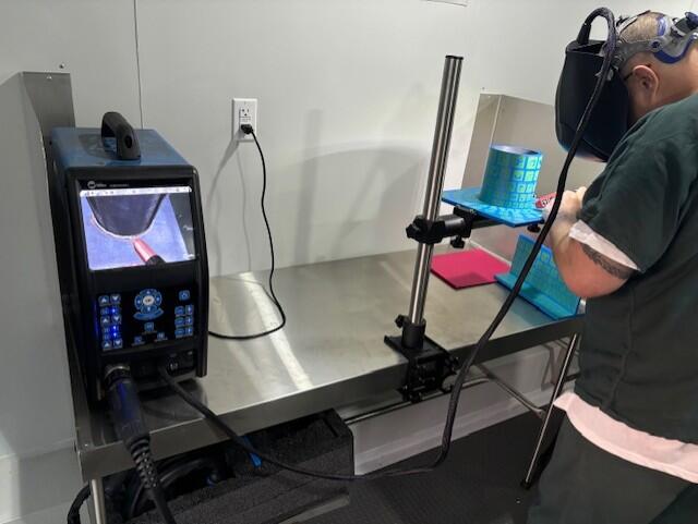 A program participant is getting hands on training for the welding industry.