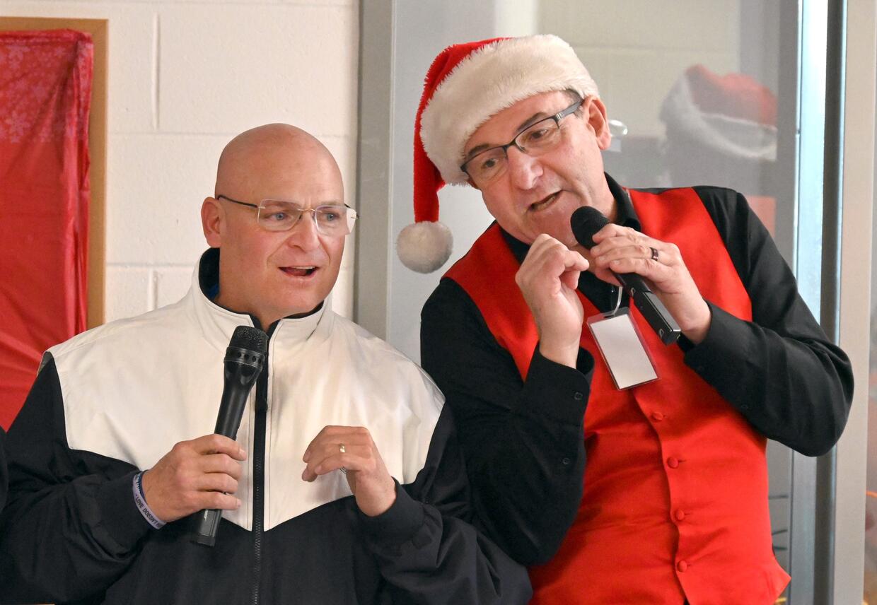 Sheriff Cocchi sings holiday songs during a concert at the women's facility