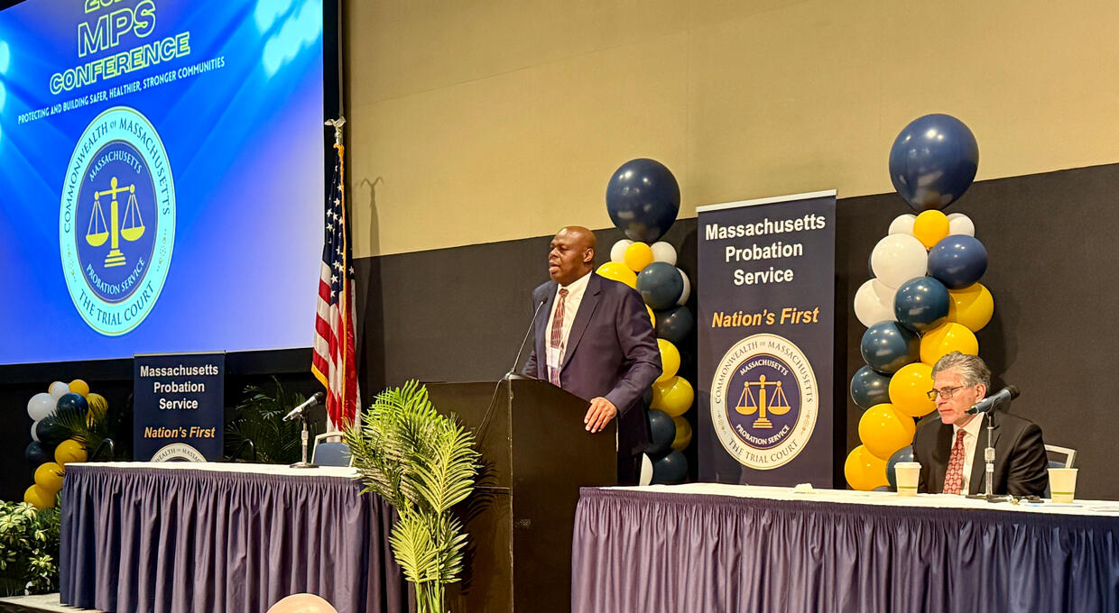 Two people speaking at a conference