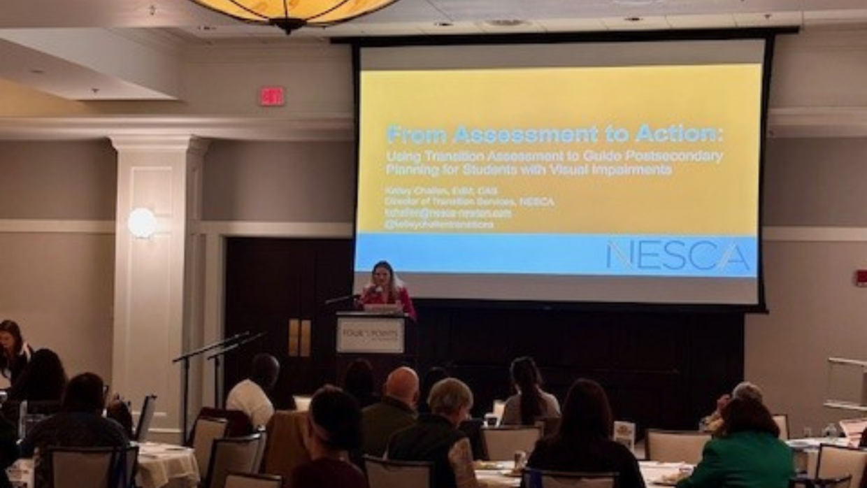 Kelley Challen presents on stage