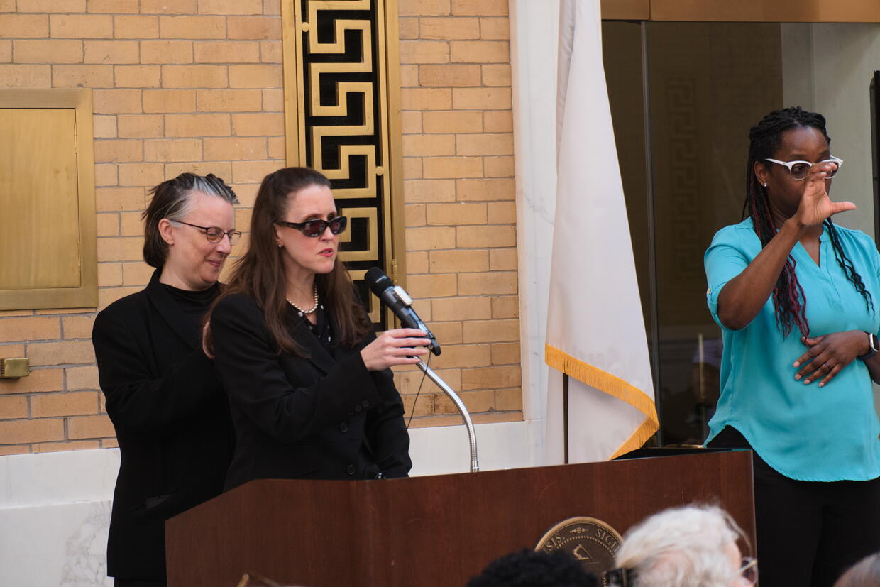 Kerry Thompson speaks from behind the podium