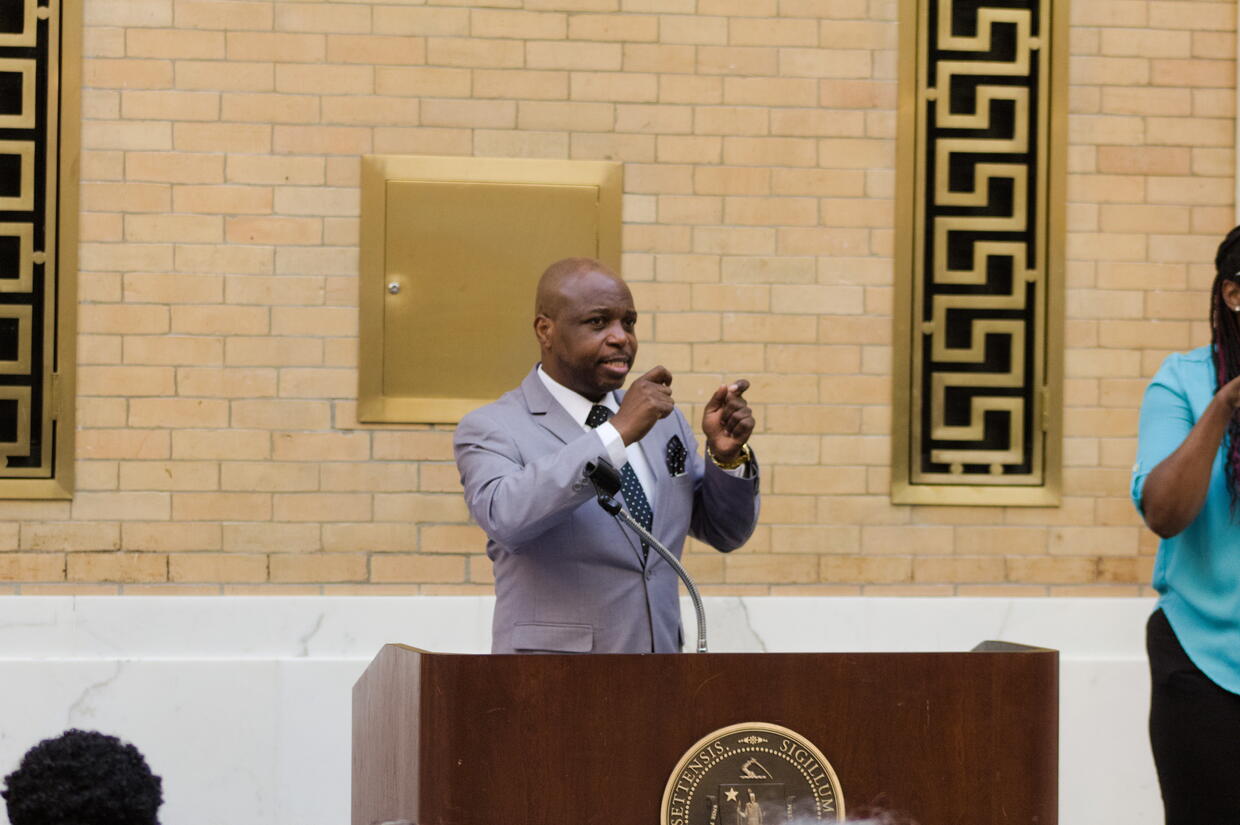 Dr. Opeoluwa Sotonwa speaking from behind the podium