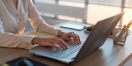 Teleworker using laptop and internet, working online