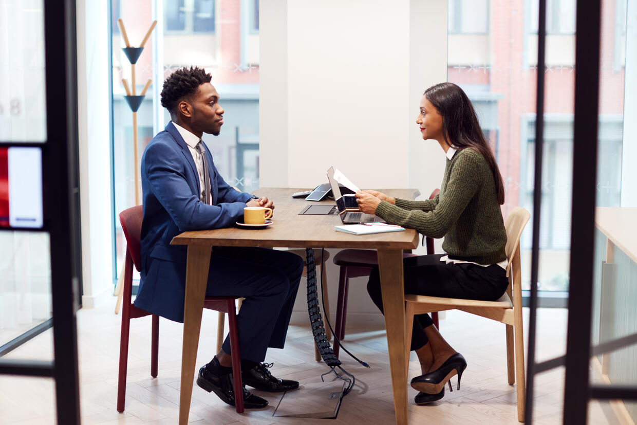 Two people interviewing