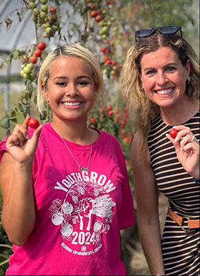 Commissioner Ashley Randle and young farmer at YouthGrow Farm, Worcester