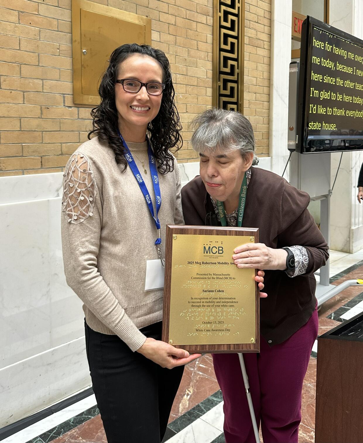 O&M Specialist Kara Peters presents Sariann Cohen with her award