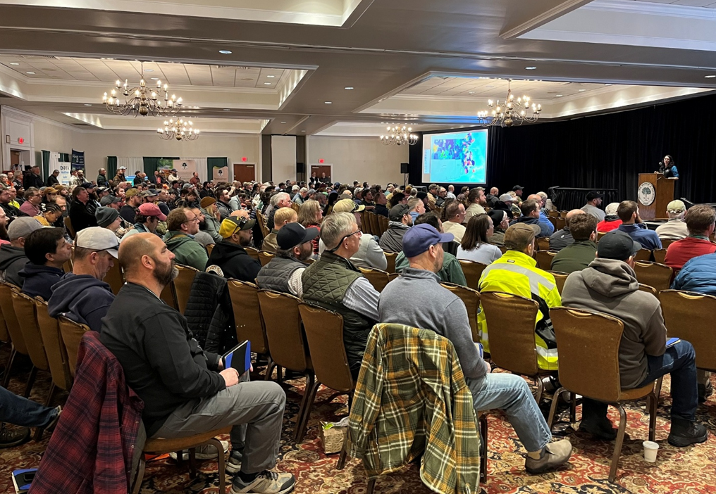 Audience of people listening to a presentation. 