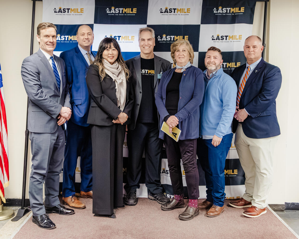 Group of officials attending The Last Mile graduation.