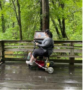 Accessibility consultant reviews trail conditions and signage