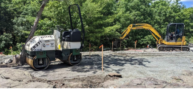 Trail and trailhead construction with heavy equipment in process.
