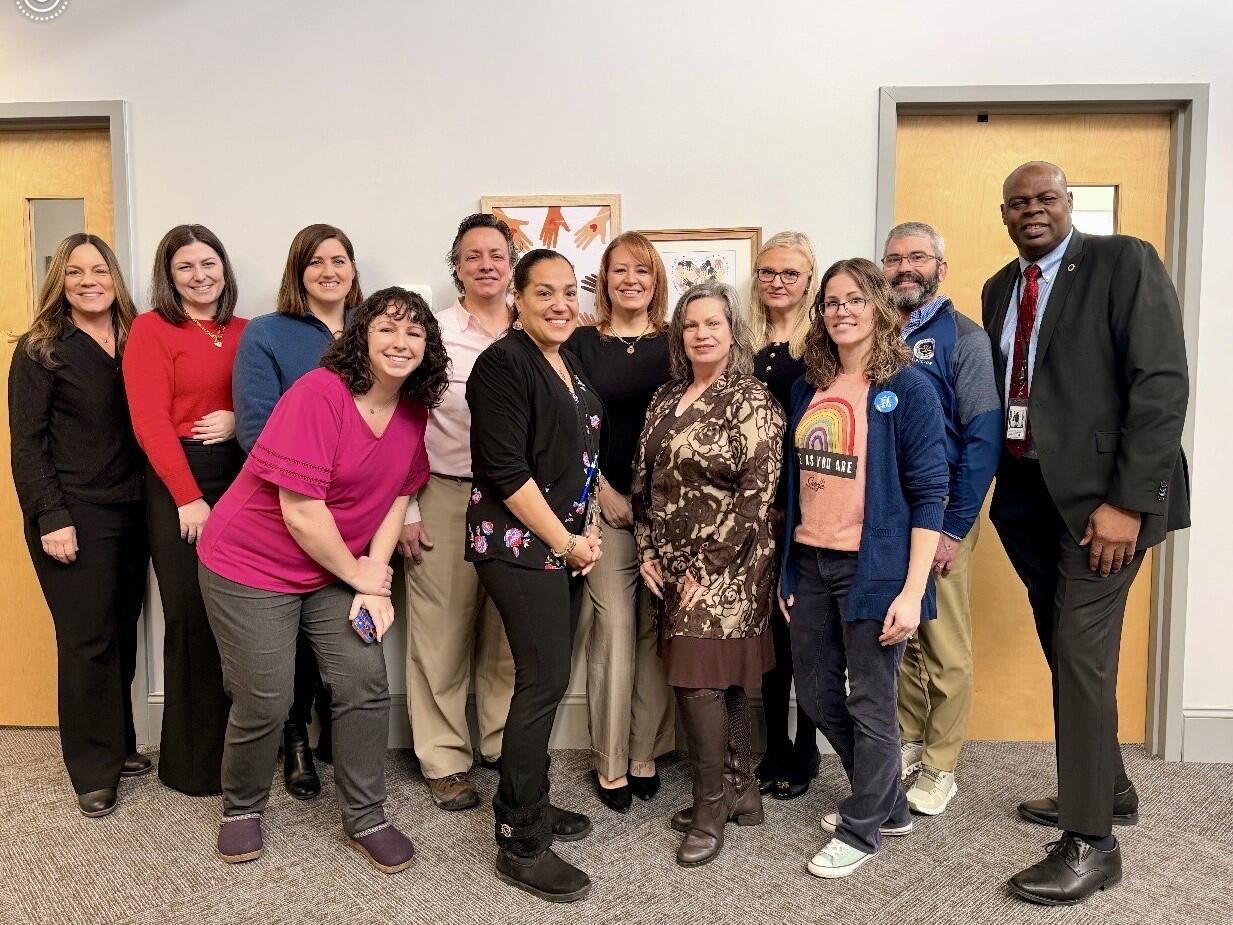 A large group pose together