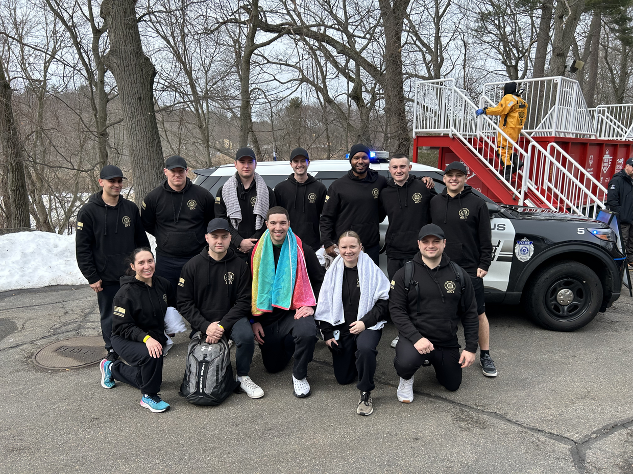 Student officers pose at a polar plunge event