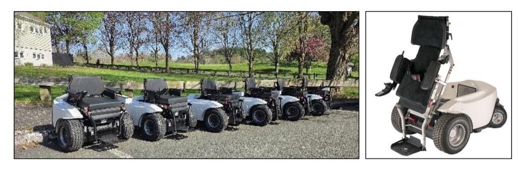 Six ParaMotion carts are lined up in front of a golf course and a cart is displayed with seat raised.