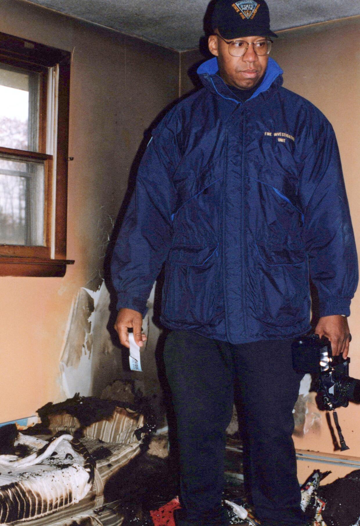 A State Police fire investigator assigned to the State Fire Marshal's office at a 1997 fire scene