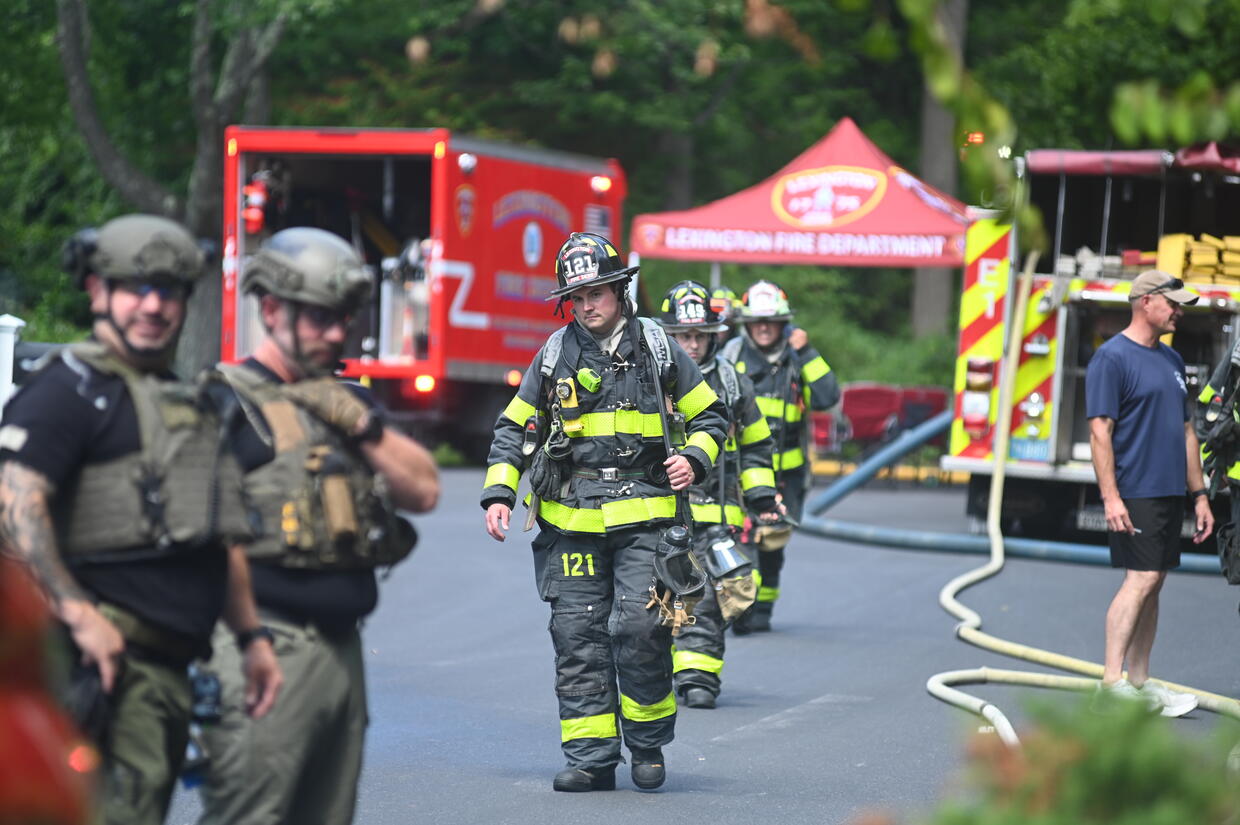 Firefighters and bomb technicians on a street