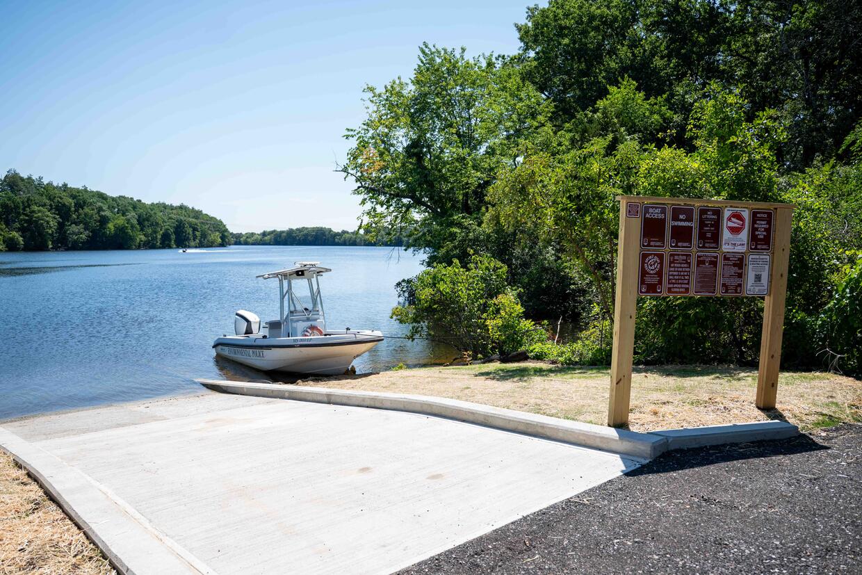 A boat is launched at the boat ramp.