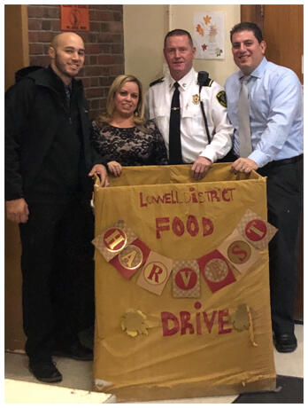 Lowell District Employees with Food Drive Basket