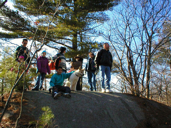 hikers on top of rock